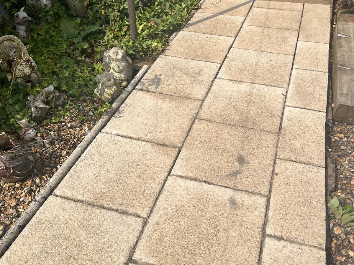 After: clean block-paved patio